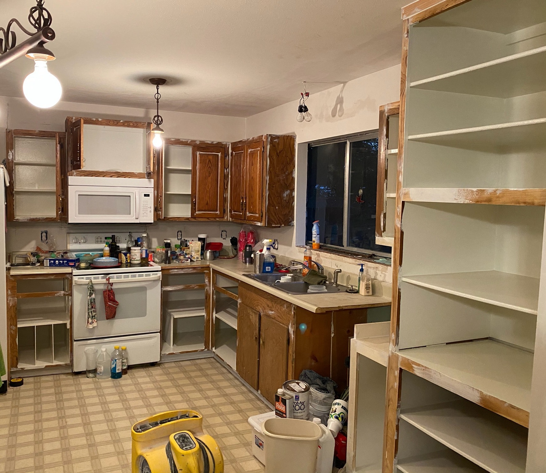 Professional handyman preparing to paint a room with equipment ready